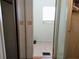 Small bathroom with a sink, toilet, and shower. Features include a vanity with a mirror and storage at 175 Bonnie Dr, Auburndale, FL 33823