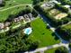 Aerial view of community with a pool and large lot at 18 Coventry Dr, Haines City, FL 33844