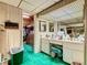 Retro bathroom with double vanity, walk-in shower, and large mirror at 18 Coventry Dr, Haines City, FL 33844