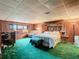Bedroom with king-size bed and wood-paneled walls at 18 Coventry Dr, Haines City, FL 33844