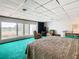 Bedroom with a king-size bed and water views at 18 Coventry Dr, Haines City, FL 33844