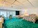 Bedroom with two double beds, teal carpeting and window views at 18 Coventry Dr, Haines City, FL 33844