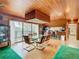 Bright dining room with glass table and access to a balcony at 18 Coventry Dr, Haines City, FL 33844