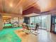 Dining room with glass table and chairs, and view to backyard at 18 Coventry Dr, Haines City, FL 33844