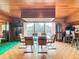 Bright dining area with glass table, access to a patio, and wood features at 18 Coventry Dr, Haines City, FL 33844