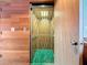 View of an open vintage elevator with a metal gate at 18 Coventry Dr, Haines City, FL 33844