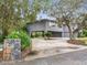 Exterior view of a raised home with a long driveway at 18 Coventry Dr, Haines City, FL 33844