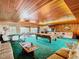 Spacious game room with pool table, seating and green carpet at 18 Coventry Dr, Haines City, FL 33844