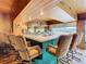Well-stocked home bar with seating for six and a view to the backyard at 18 Coventry Dr, Haines City, FL 33844