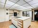 Modern kitchen with a large island, stainless steel appliances and white cabinets at 18 Coventry Dr, Haines City, FL 33844