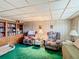 Living room with two armchairs, sofa, and built-in shelving at 18 Coventry Dr, Haines City, FL 33844