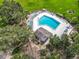 Community pool with lounge chairs and a pool house at 18 Coventry Dr, Haines City, FL 33844