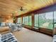 Sunroom with wood ceiling, large windows and seating area at 18 Coventry Dr, Haines City, FL 33844
