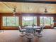 Sunroom with wood ceiling, large windows and golf course view at 18 Coventry Dr, Haines City, FL 33844