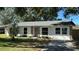 Newly renovated single-story home with stone accents and a landscaped yard at 2002 Sutton Rd, Lakeland, FL 33810