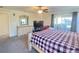 Spacious main bedroom with a large TV and dresser at 222 Cattail Way, Lake Alfred, FL 33850