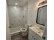 Modern bathroom with walk-in shower and grey tile at 2349 Lisa St, Lake Wales, FL 33898