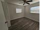 Well-lit bedroom featuring wood-look floors and ceiling fan at 2349 Lisa St, Lake Wales, FL 33898