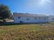 Back view of a house showcasing a large backyard at 2349 Lisa St, Lake Wales, FL 33898