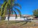 Newly renovated home with a fenced yard and carport at 2349 Lisa St, Lake Wales, FL 33898