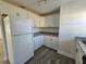 White kitchen cabinets and granite countertops at 2349 Lisa St, Lake Wales, FL 33898