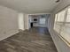 Open living space with laminate flooring and kitchen view at 2349 Lisa St, Lake Wales, FL 33898