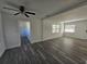 Spacious living room with wood-look floors and ceiling fan at 2349 Lisa St, Lake Wales, FL 33898