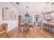 Bright dining area with a round table and woven chairs near kitchen at 2997 Sequoyah Dr, Haines City, FL 33844