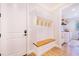 Inviting entryway with built-in bench and coat hooks at 2997 Sequoyah Dr, Haines City, FL 33844