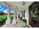 Inviting front porch with rocking chairs and landscaping at 2997 Sequoyah Dr, Haines City, FL 33844