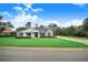 Charming house with a lush green lawn and landscaping at 2997 Sequoyah Dr, Haines City, FL 33844