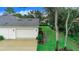 Attached two-car garage with a large driveway at 2997 Sequoyah Dr, Haines City, FL 33844