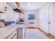 Well-appointed laundry room with washer, dryer, and overhead storage at 2997 Sequoyah Dr, Haines City, FL 33844