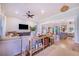 Open living room with hardwood floors and view of kitchen at 2997 Sequoyah Dr, Haines City, FL 33844