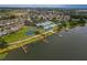 Aerial view of community with lake, pool, and clubhouse at 3309 Raleigh Dr, Winter Haven, FL 33884