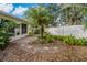 Backyard with circular stone path and lush landscaping at 3309 Raleigh Dr, Winter Haven, FL 33884