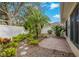 Brick paved patio and tropical landscaping in backyard at 3309 Raleigh Dr, Winter Haven, FL 33884