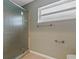 Bathroom with a glass shower enclosure and neutral walls at 3309 Raleigh Dr, Winter Haven, FL 33884
