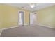 Spacious bedroom with two entry doors and ceiling fan at 3309 Raleigh Dr, Winter Haven, FL 33884