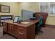 Community business center with computers, desk, and shelving at 3309 Raleigh Dr, Winter Haven, FL 33884