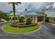 Community clubhouse with circular drive and landscaping at 3309 Raleigh Dr, Winter Haven, FL 33884