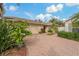 Inviting home exterior featuring a paved driveway and lush landscaping at 3309 Raleigh Dr, Winter Haven, FL 33884