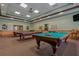 Game room with two billiard tables and seating at 3309 Raleigh Dr, Winter Haven, FL 33884