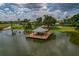 Lakeside gazebo with wooden deck offering scenic views at 3309 Raleigh Dr, Winter Haven, FL 33884
