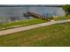 Wooden dock extending into the lake, perfect for fishing at 3309 Raleigh Dr, Winter Haven, FL 33884