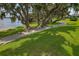 Scenic lakeside walking path shaded by majestic oaks at 3309 Raleigh Dr, Winter Haven, FL 33884