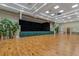 Large room with a stage and hardwood floors at 3309 Raleigh Dr, Winter Haven, FL 33884