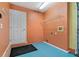 Laundry room with built-in shelving and exterior access at 3309 Raleigh Dr, Winter Haven, FL 33884