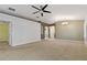 Spacious living room with carpet flooring, neutral walls, and sliding glass doors leading to the outdoors at 3309 Raleigh Dr, Winter Haven, FL 33884