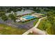 Aerial view of community pool, spa, and clubhouse at 3309 Raleigh Dr, Winter Haven, FL 33884
